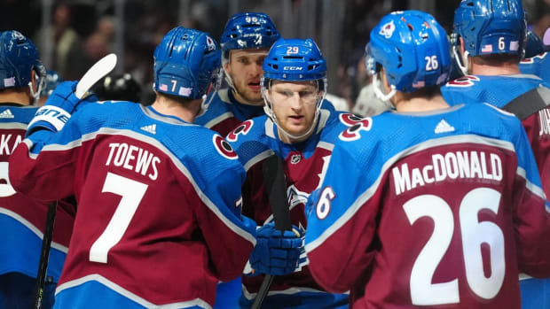 Nov 12, 2022; Denver, Colorado, USA; Colorado Avalanche center Nathan MacKinnon (29) celebrates his third period with teammates against the Carolina Hurricanes at Ball Arena. Mandatory Credit: Ron Chenoy-USA TODAY Sports